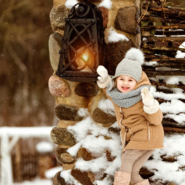 Very sweet beautiful little girl child in a beige coat crusade a — Stock Photo, Image