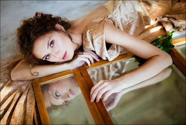 Portrait of a sensual kinky girl with closed eyes bare backed in beige — Stock Photo, Image