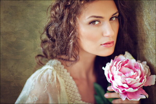 Sensual sexy beautiful curly girl with flowers, close up