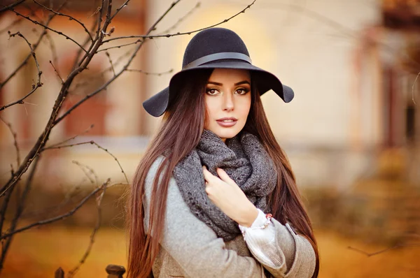 Portrait of a very beautiful young brunette woman with shiny str