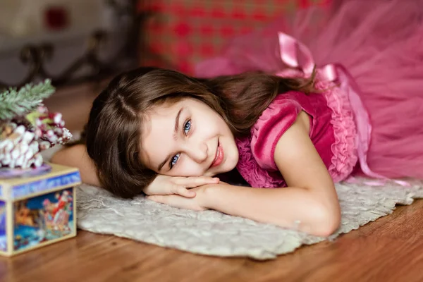 Little Blonde Happy Girl In Pink Swimsuit Lying On The Floor — Stock