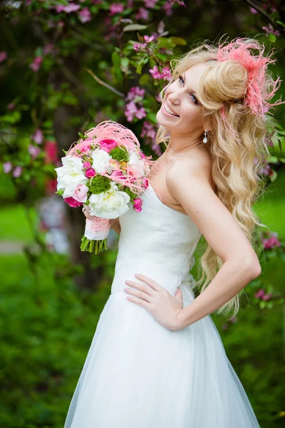 Very beautiful happy bride blonde curly hair in a white dress an — Stock Photo, Image
