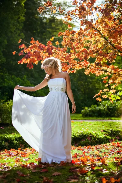 Portrait of a beautiful bride with a diadem of flowers on his he