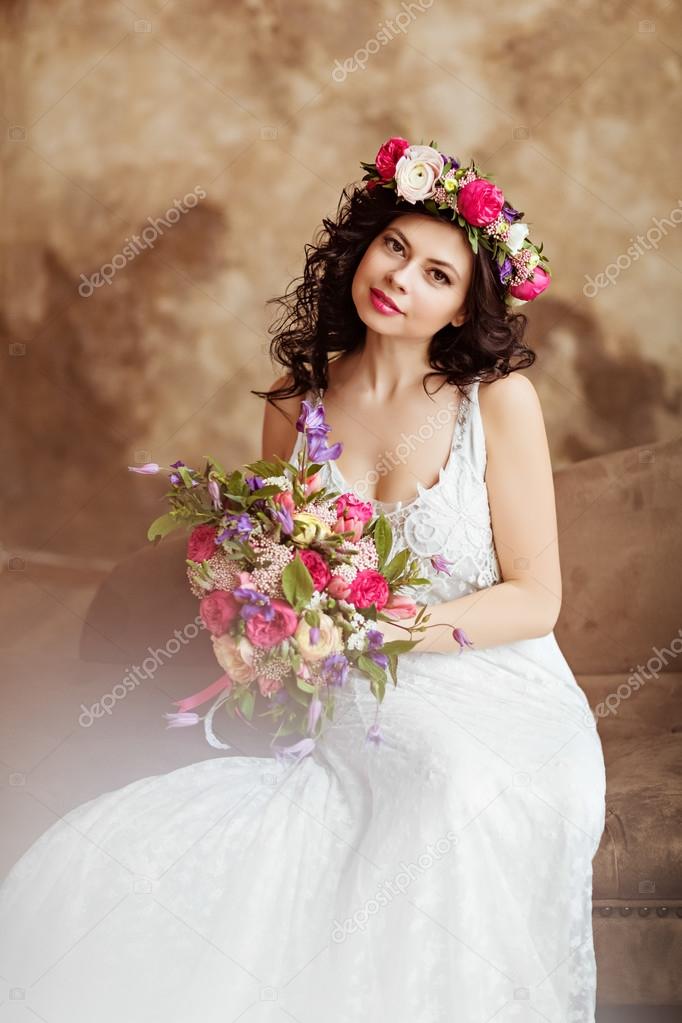 Portrait of beautiful sensual girls brunette in white lace dress