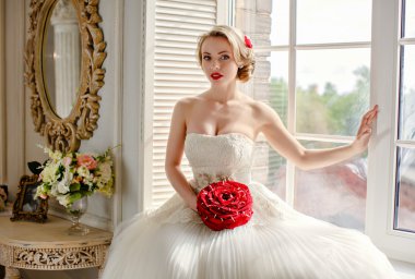 Charming beautiful young blonde girl with red lipstick on my lip