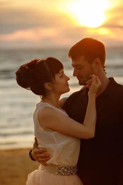 A man and a woman in a lush short skirt, looking at each other t — Stock Photo, Image