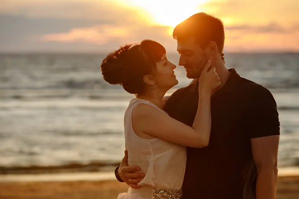 A man and a woman in a lush short skirt, looking at each other t — Stock Photo, Image