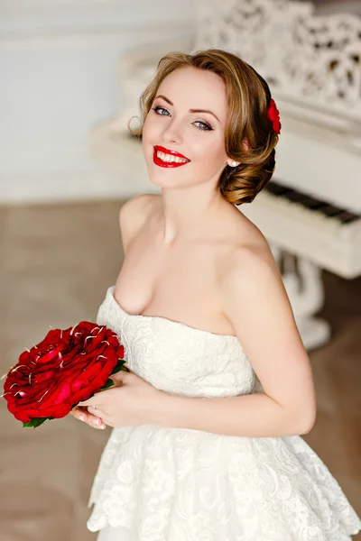 Charming blonde girl with beautiful smile in a white lace dress — Stock Photo, Image