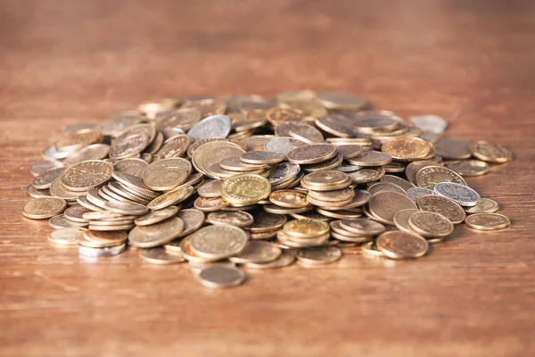 Money coin spare change pile dark wood background. — Stock Photo, Image