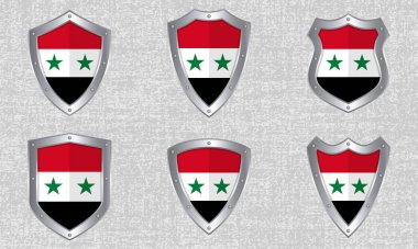 Suriye Arap Cumhuriyeti bayrağı ve gölgesi olan metal kalkanlar.