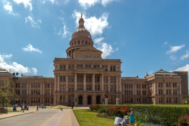 People playing around government building