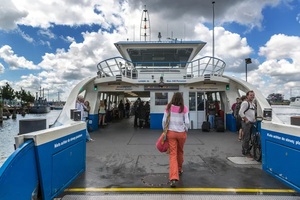 Woman getting inside ferry in Amsterdam — Zdjęcie stockowe
