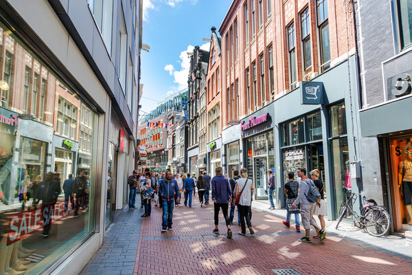 Group of tourists and locals walking in downtown