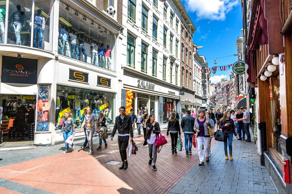 Group of tourists and locals walking in downtown