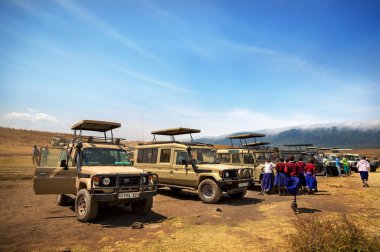 Tourists enjoying beautiful day in Ngorongoro clipart