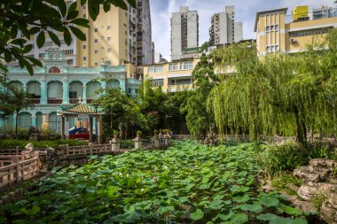 chinese garden of Macau in sunny day clipart