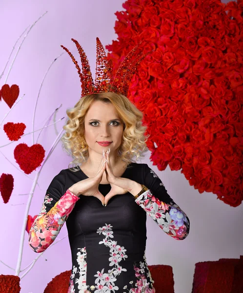 Very beautiful,cheerful, attractive, cute, nice, delightful, adorable, wonderful, notable, well-mannered, well-educated, famous blonde girl, woman, queen, princess with big, red corona, crown, diadem, coroneta . Holiday St. Valentine's Day. — Stock Photo, Image