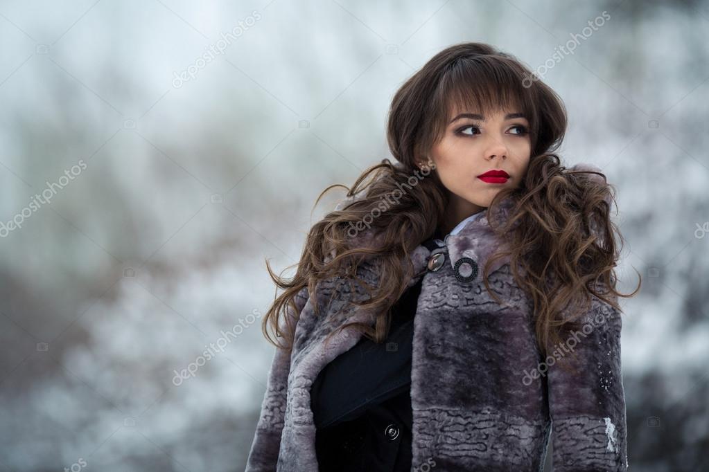 Fashionable Glamorous Model Girl With Curly Wavy Hair Red Lips Perfect Make Up Fur Coat From Mouton Looks Somewhere Look Away Girl With Curly Wavy Hair Red Lips, Red Curly Fur Coat