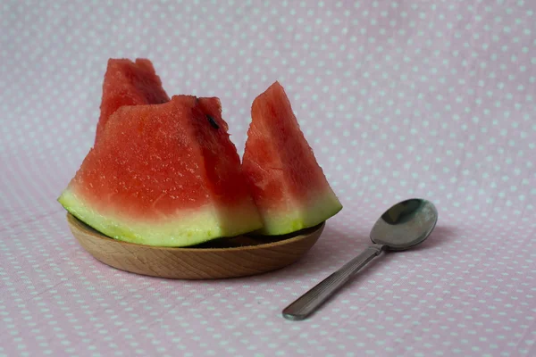 Fresh watermelon cut with slice, on wood plate with cute backgro — Stock Photo, Image