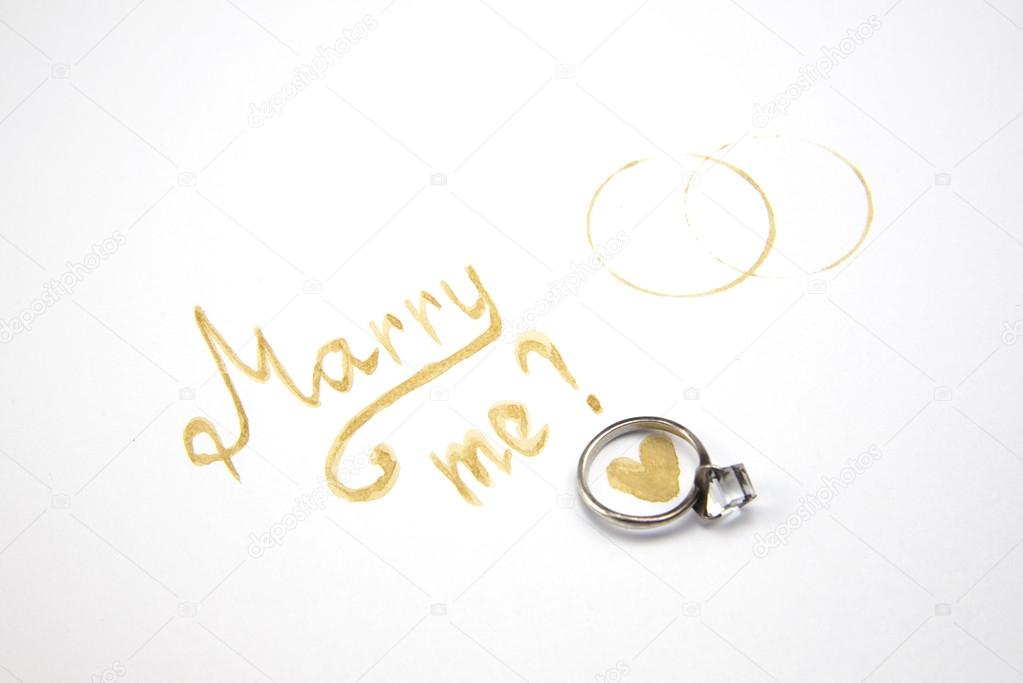 marry me sign with coffee mark at white wallpaper