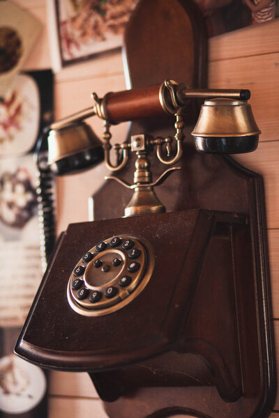 Vintage old phone on the wall in the room