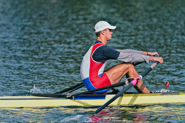 Single scull rowing competitor