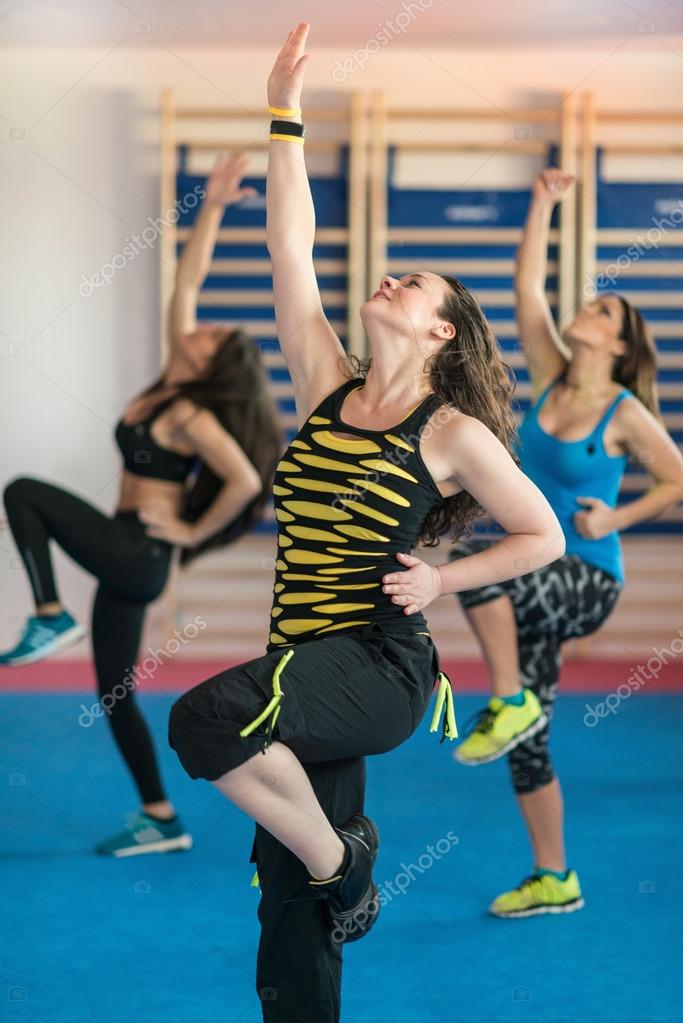 Young women in Zumba training — Stock Photo © microgen 114735314