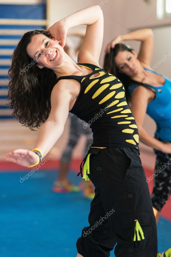 Women at Zumba class Stock Photo by ©microgen 114735448