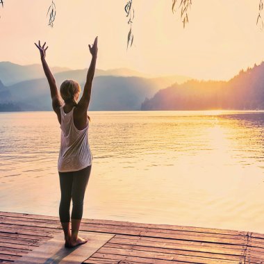 woman practicing Sun salutation Yoga  clipart