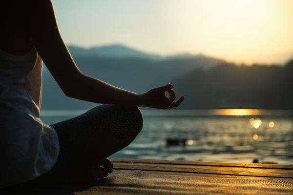 Woman sitting in lotus position — Stock Photo, Image