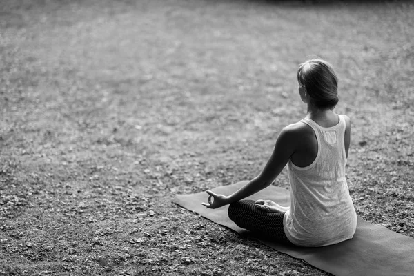 Young woman in lotus position — Stock Photo, Image