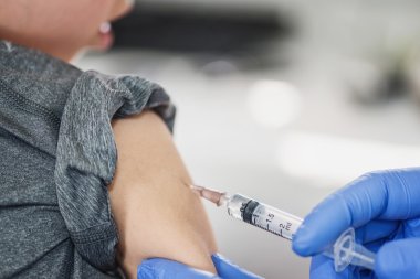 little boy receives vaccination clipart
