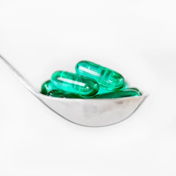 Pillole vitaminiche in cucchiaio — Foto Stock