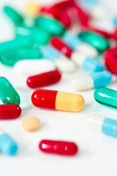 Variety of pills on white table — Stock Photo, Image