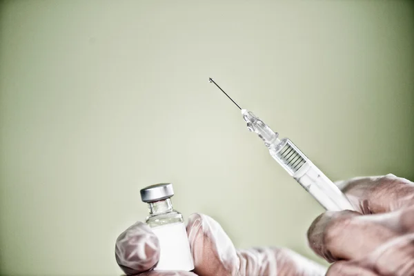 Doctor hands holding syringe — Stock Photo, Image
