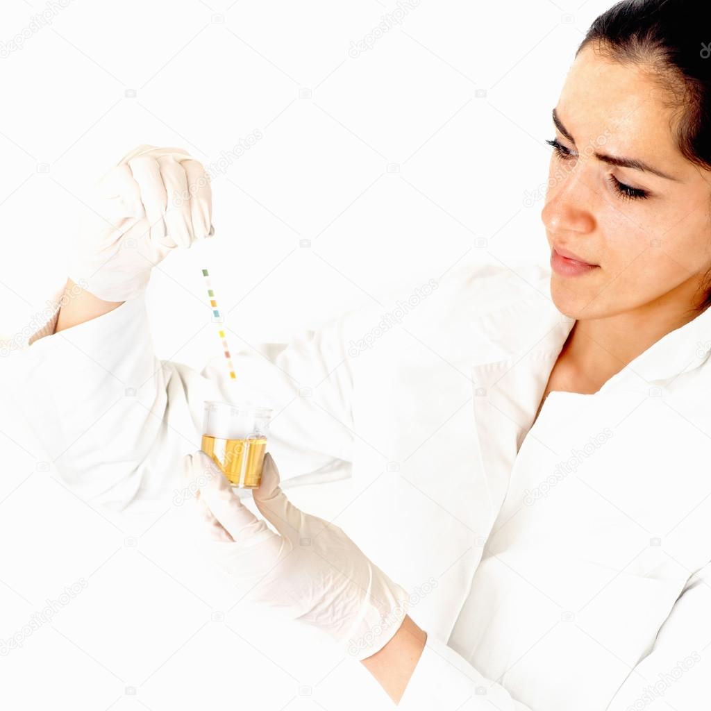 Lab technician analyzing urine sample