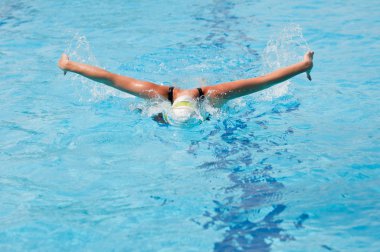 Woman swimming Butterfly stroke clipart