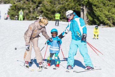 Family skiing on vacation clipart