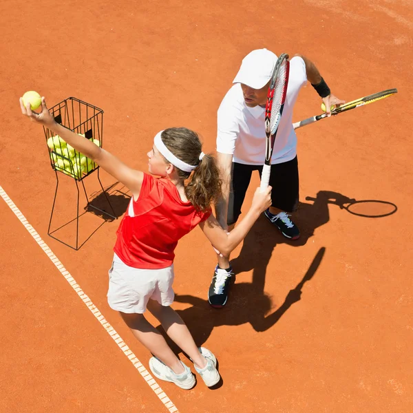 Junior tennis player with coach — Stock Photo, Image