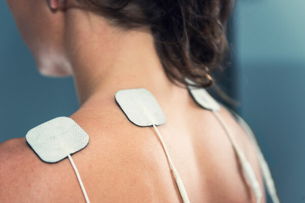 TENS electrodes on shoulders