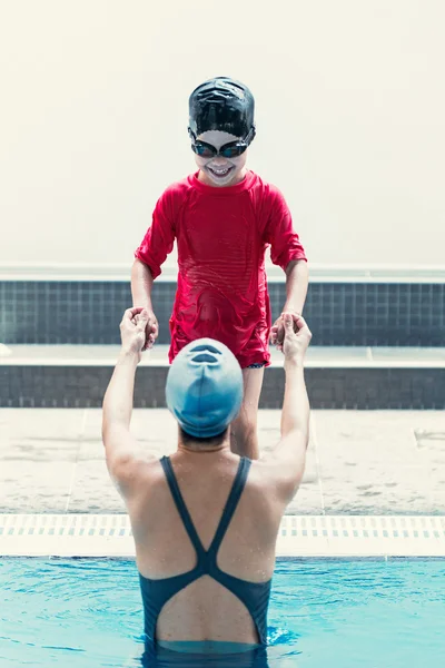 Cute little boy hesitant about getting into water — Stock Photo, Image