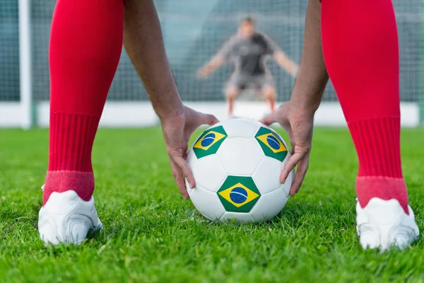 Striker placing ball — стоковое фото