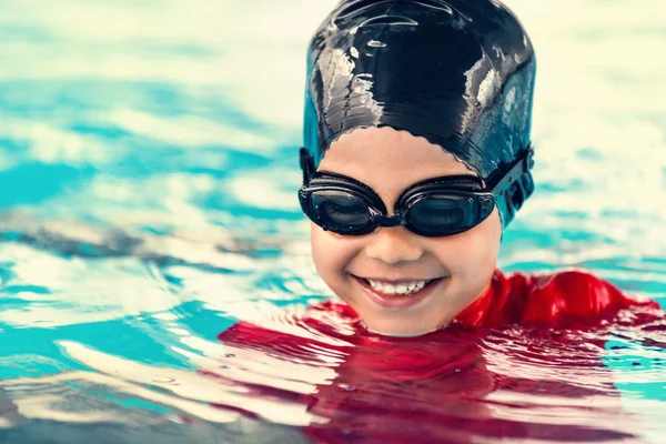 Boy feeling happy in the pool Stock Photo