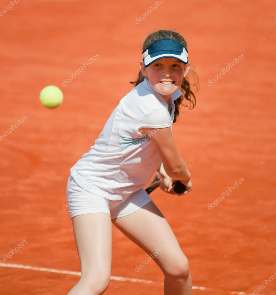 Junior tennis player Stock Photo by ©microgen 115179068