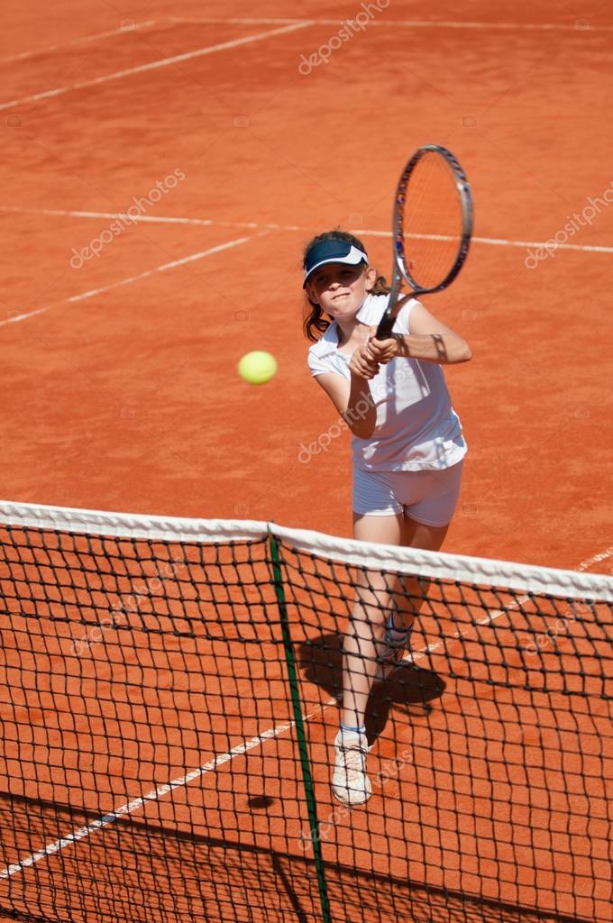 Junior Tennis player Stock Photo by ©microgen 115179630