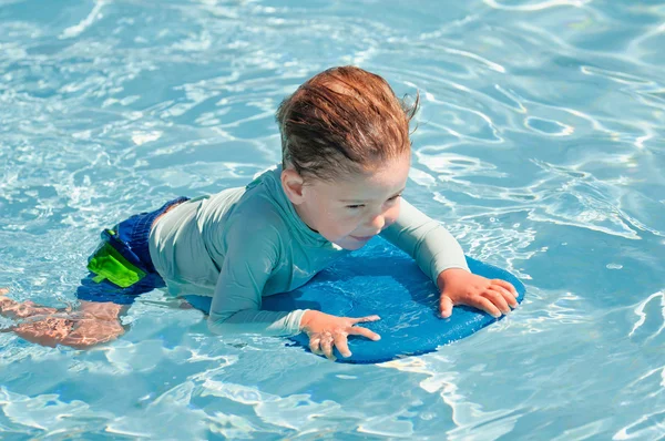 Little boy with swimboard — Stock Photo, Image