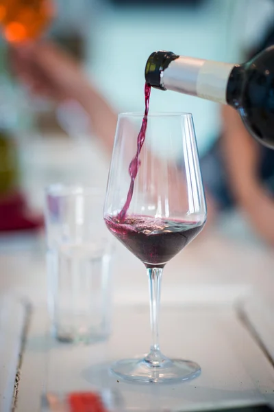 Pouring wine in glass — Stock Photo, Image