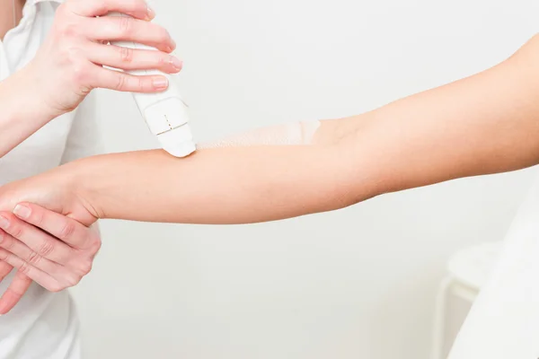 Waxing female arms