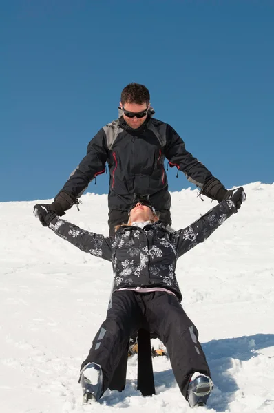 Couple having fun on snow — Stock Photo, Image