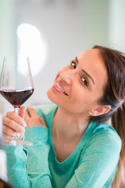 Woman drinking wine Stock Image